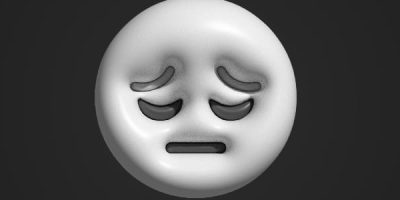 A button with a sad face.